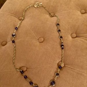 Ann Taylor navy blue with a gold chain.